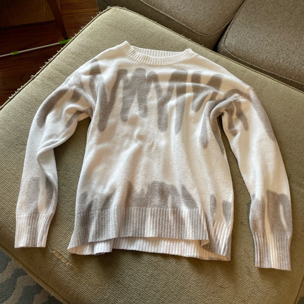 Grey and white sweater.